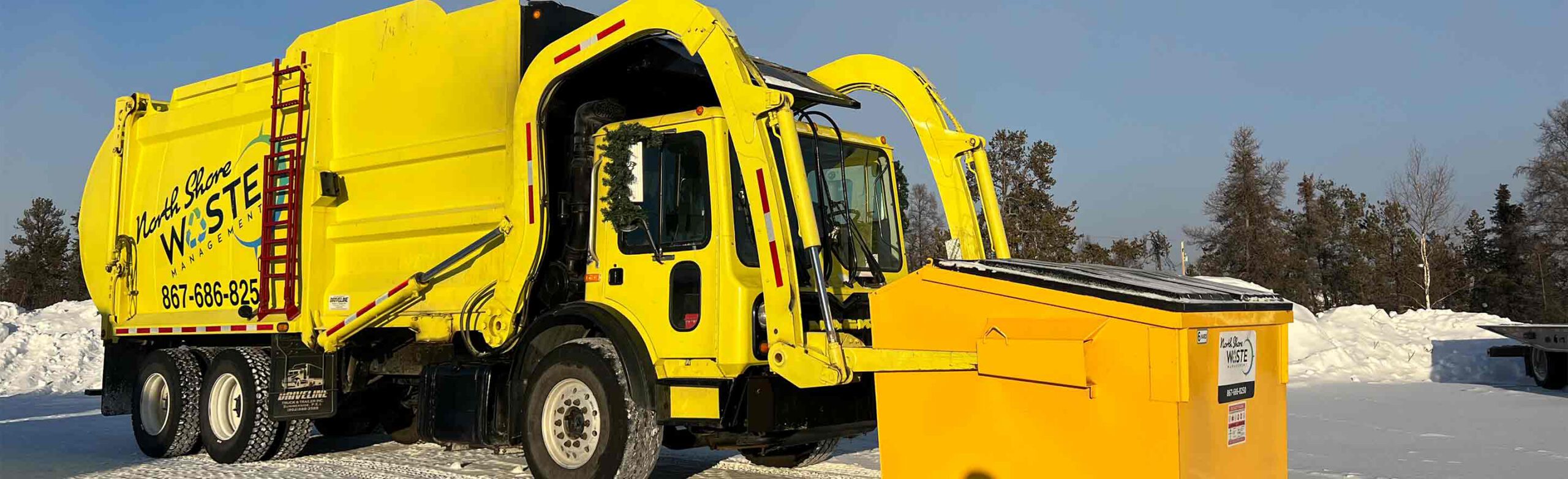 North shore waste garbage truck picking up a garbage bin
